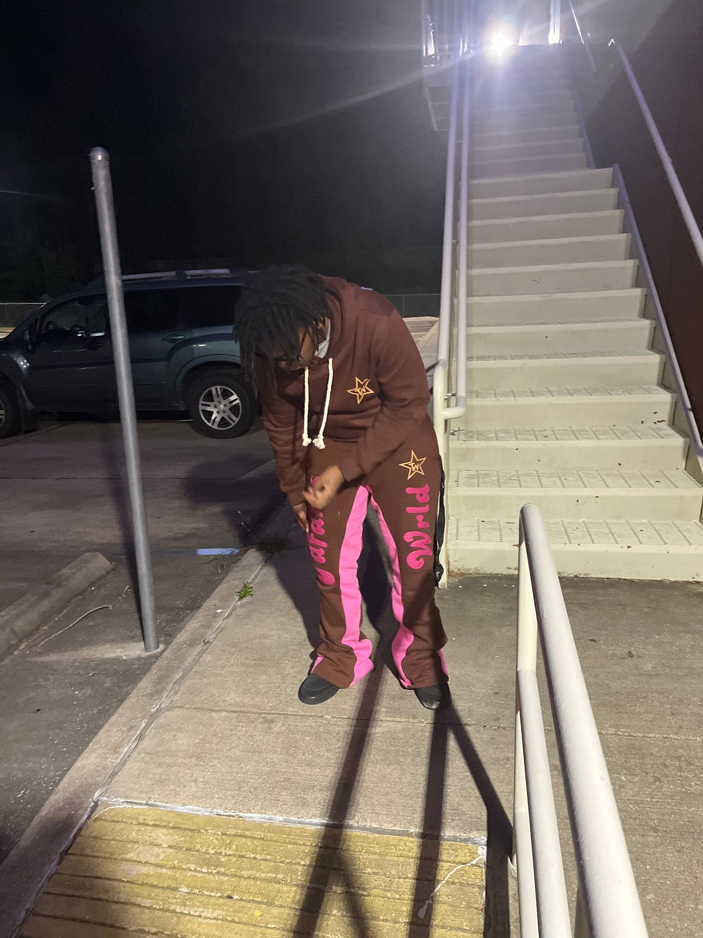 “Tafari’s Wrld” Brown Distressed Flared Pants